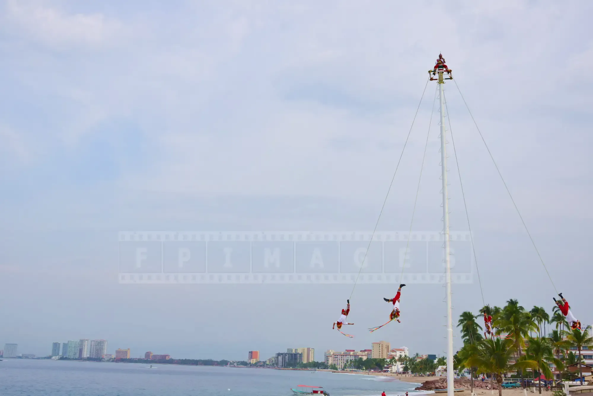 Native totonac people of Mexico performing flying act as per their traditional ritual to honor gods.